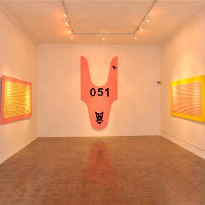 Exposition personnelle en 2010 - Musées de la Ville de Béziers- vue partielle - Série ''Take your ticket'' - peinture fluo+tickets file d’attente sur bois.